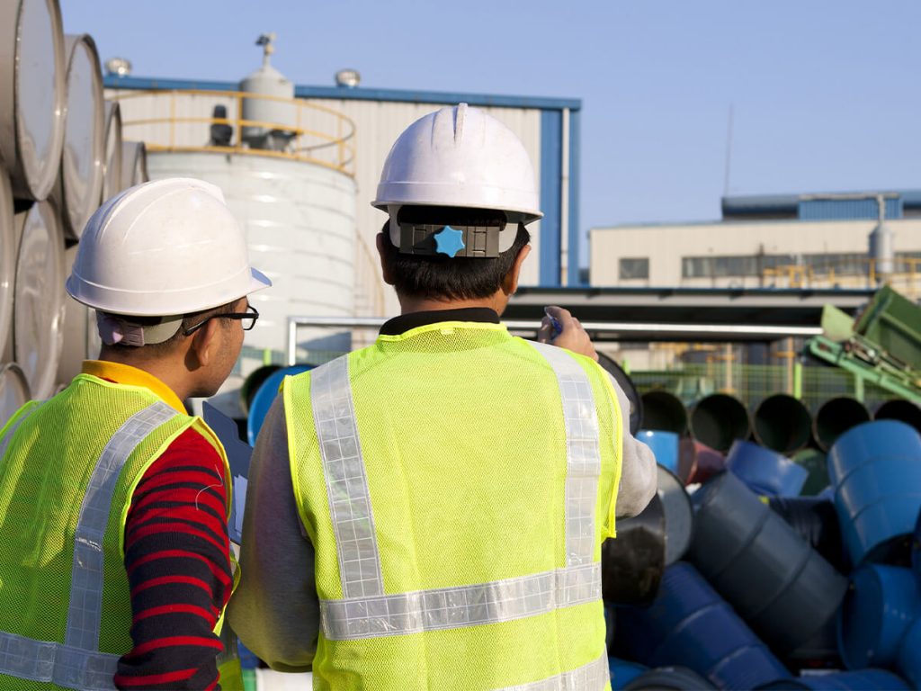 industrial professionals assessing hazardous waste